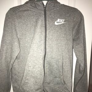 A gray Nike zip up jacket/ hoodie